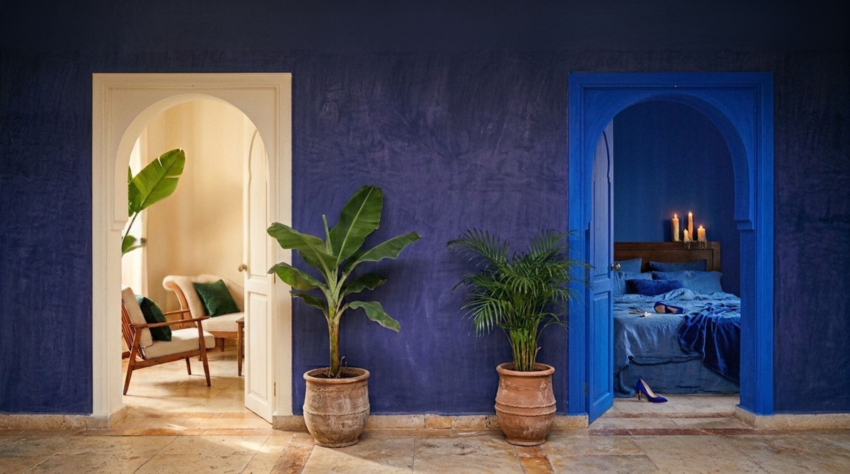 Two archways in a blue wall: a light room on the left, a blue room on the right